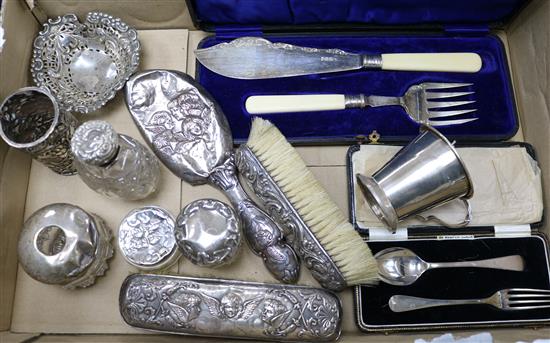 A quantity of assorted silver including brushes, cup, scent bottle cased fish servers and pierced bonbon dish.